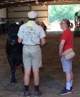 Samuel Barr and Avery Lee chatting in the barn.